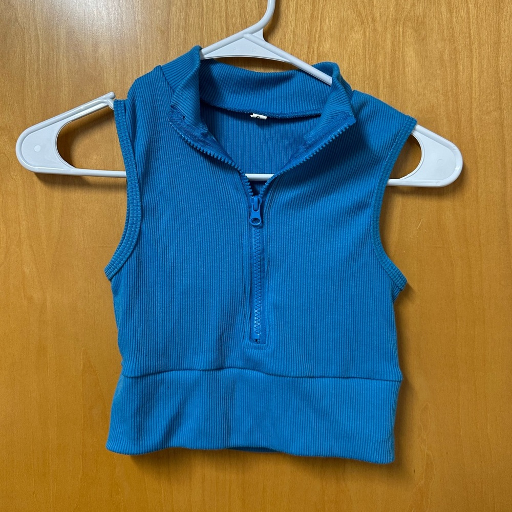 blue zip up going out top